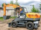 ЭКСМАШ E140W колесный экскаватор