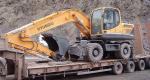 Колесный экскаватор в аренду полноповоротный